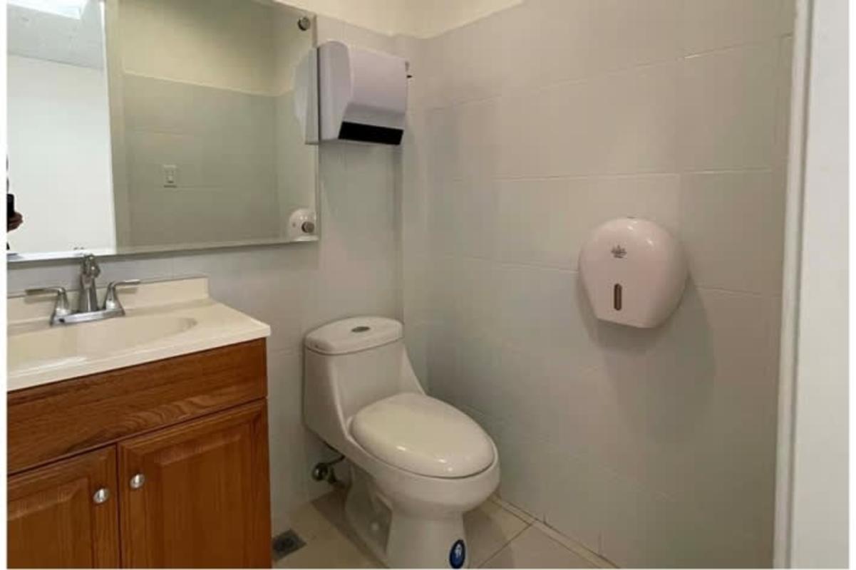 Executive style compact bathroom for commercial office with elegant finishes in PH Financial Park