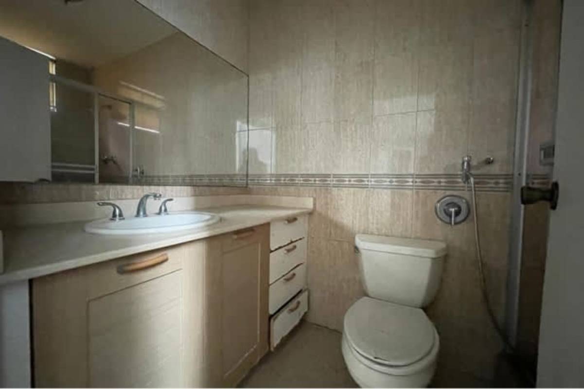 Living room with floor-to-ceiling windows city and ocean view Panama