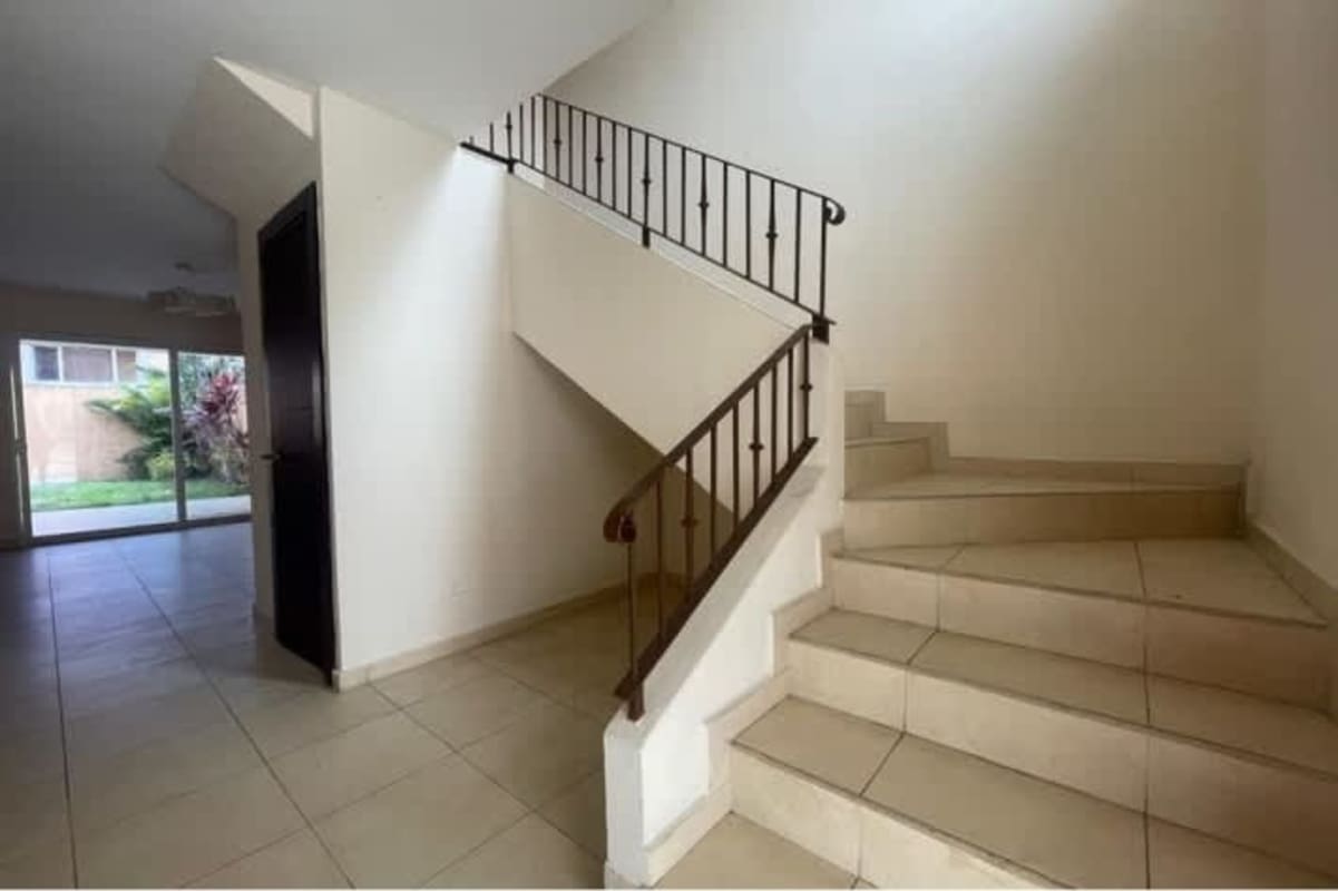 Unfurnished bedroom with large windows garden view in Brisas del Golf house Panama City