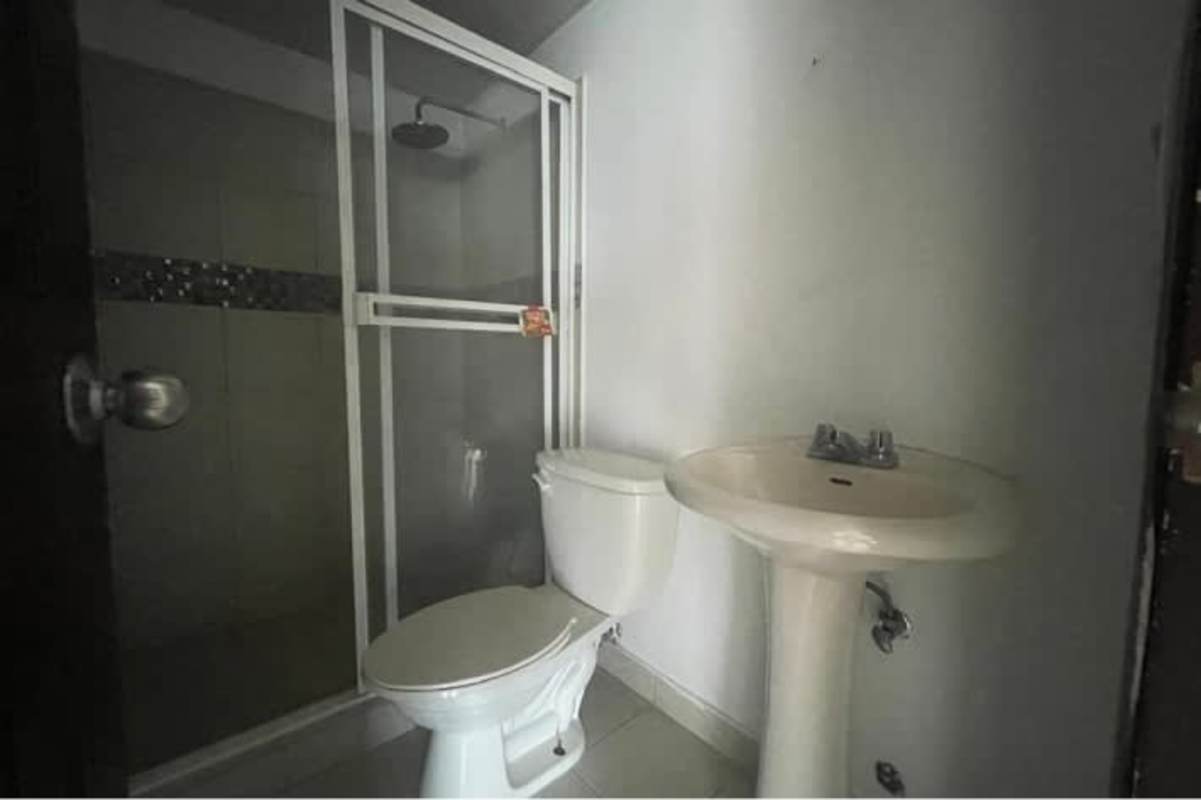 Contemporary bathroom with glass shower and pedestal sink PH Parque Lefevre Panama