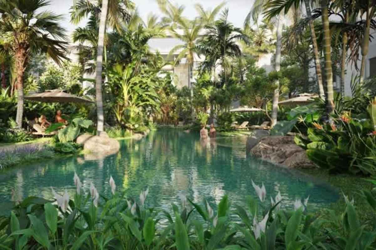Lagoon pool surrounded by palm trees and lush landscaping in Ocean Reef Islands community Panama