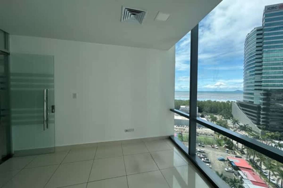 Open office with floor-to-ceiling windows and ocean skyline views in PH Financial Park Panama