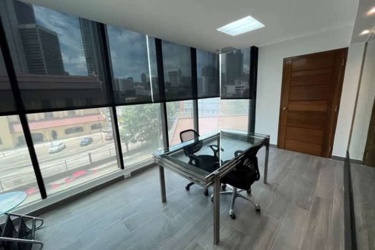 Office space with glass door and urban skyline PH Financial Center Obarrio Panama