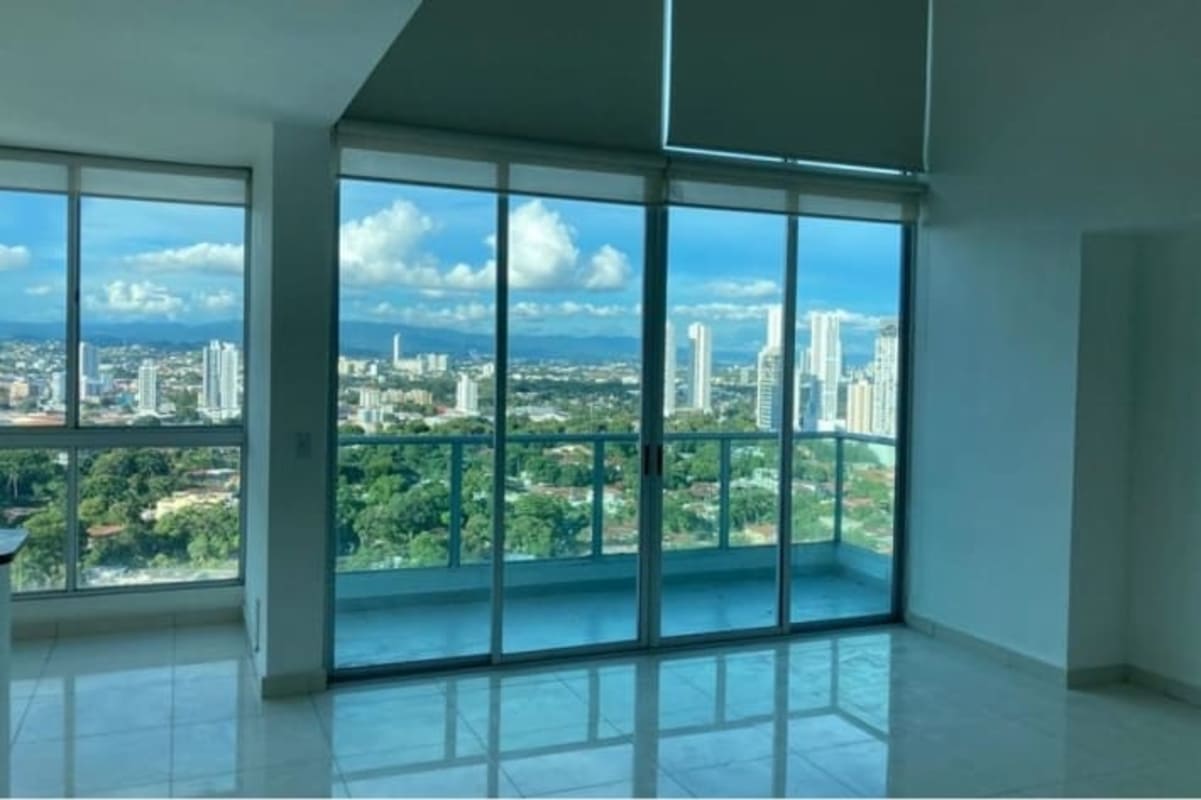 Modern duplex apartment featuring staircase to mezzanine and open kitchen in Park Loft San Francisco Panama