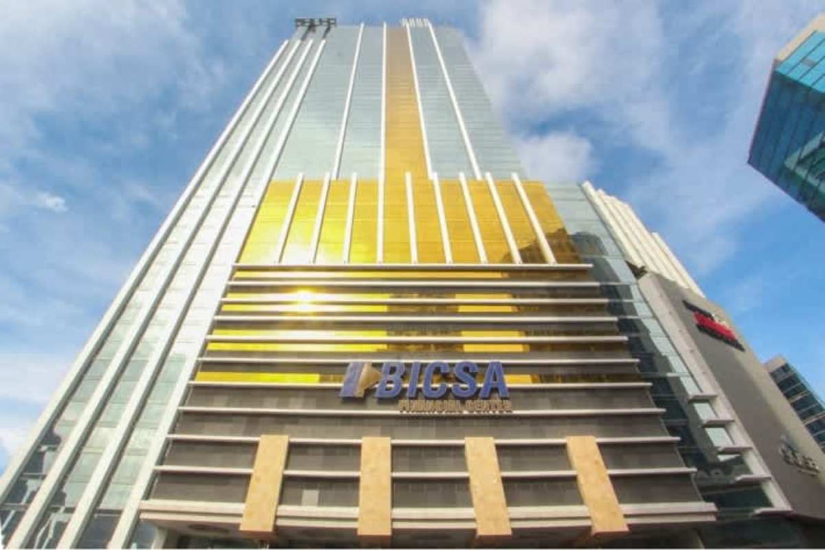 Iconic glass skyscraper BICSA Tower gold tinted facade Avenida Balboa Panama