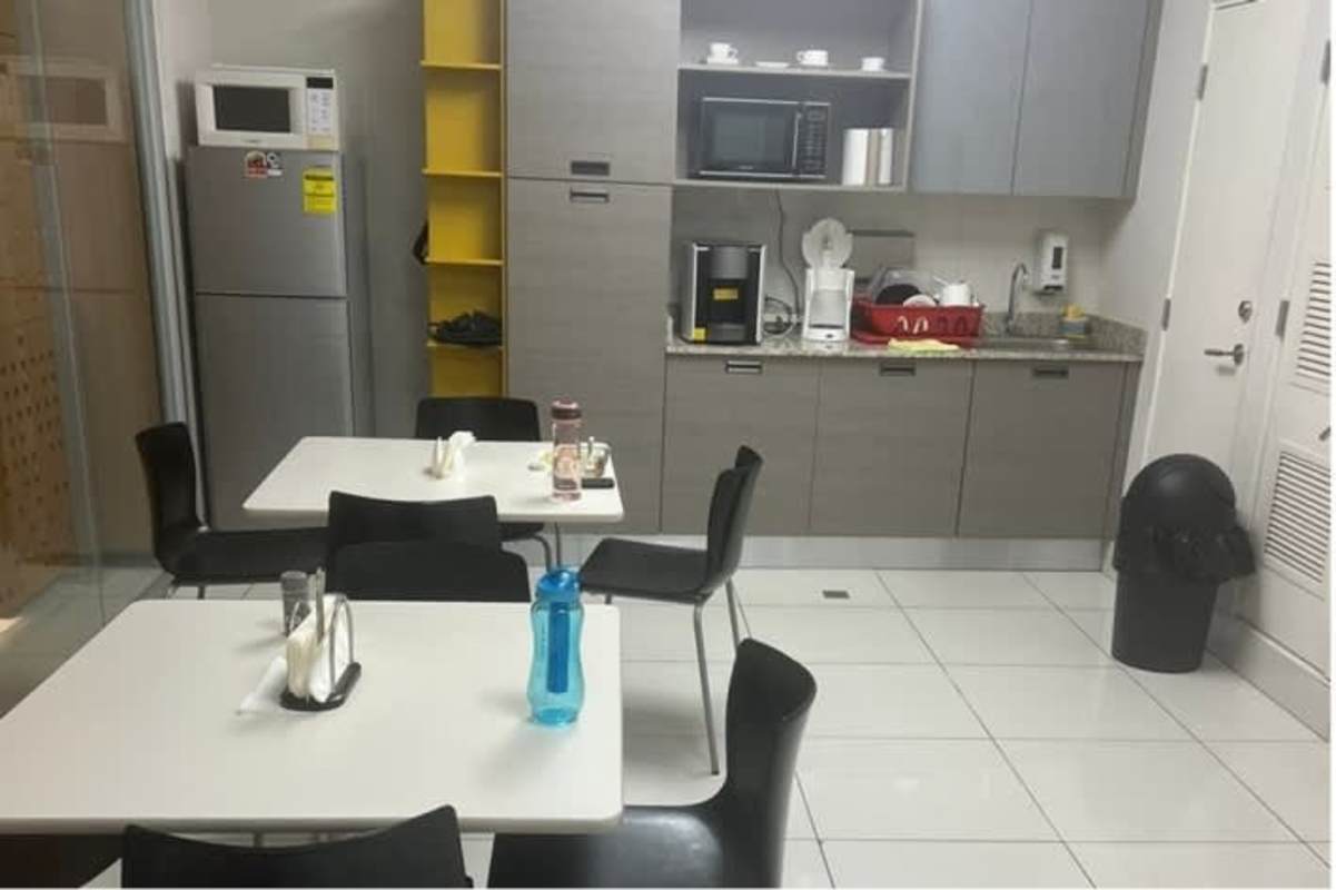 Bathroom with white fixtures, brown textured tiles in Commercial Plaza Obarrio Panama
