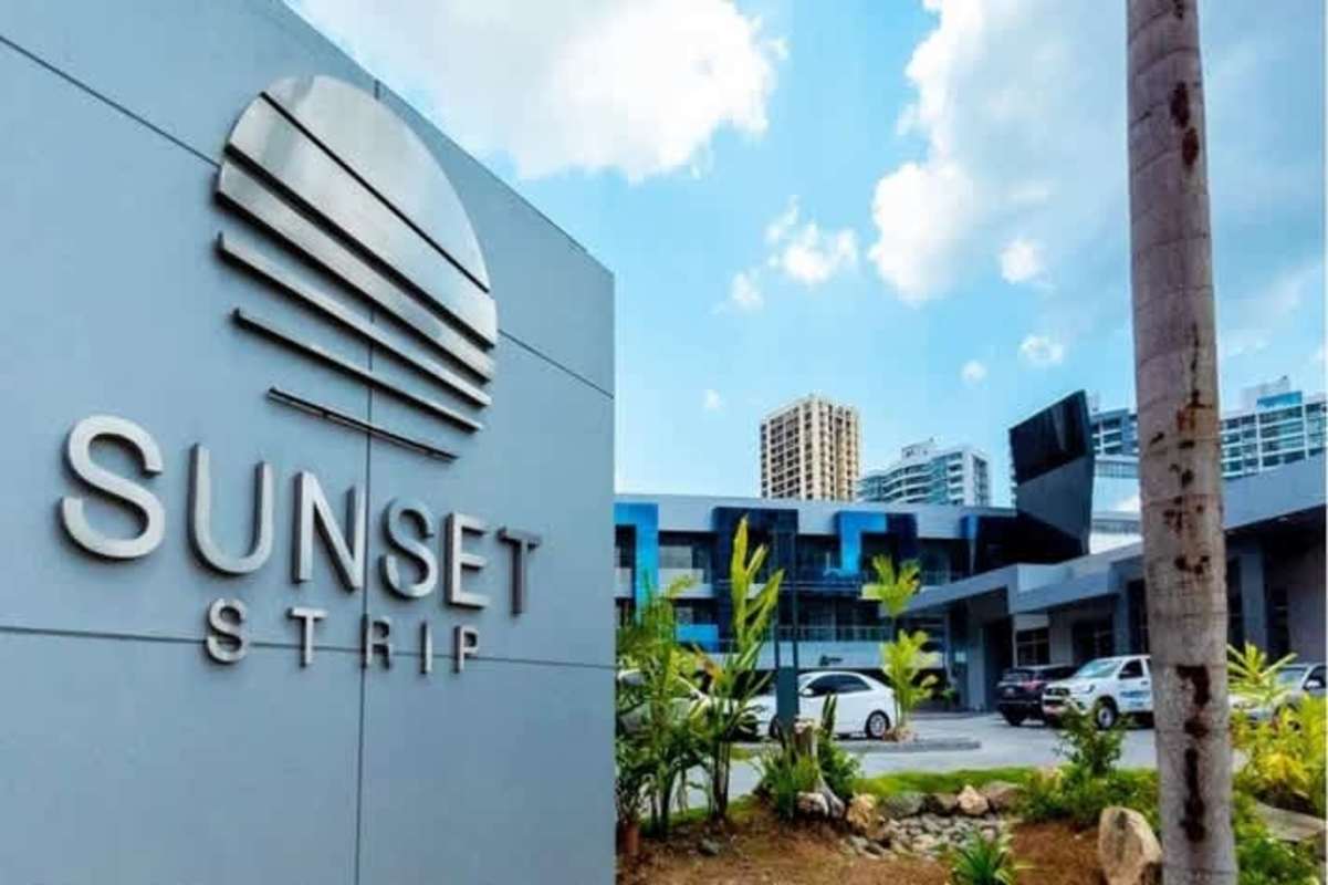 Retail shopping corridor with marble floor, wood ceiling and storefronts in Sunset Strip commercial center Panama City