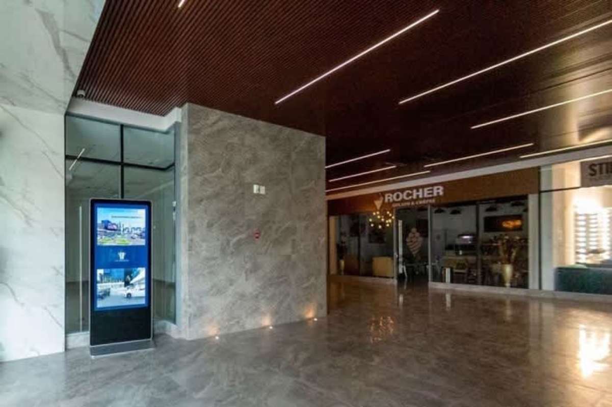 Glass storefronts exterior retail units Plaza Sunset Strip Panama on Vía Israel