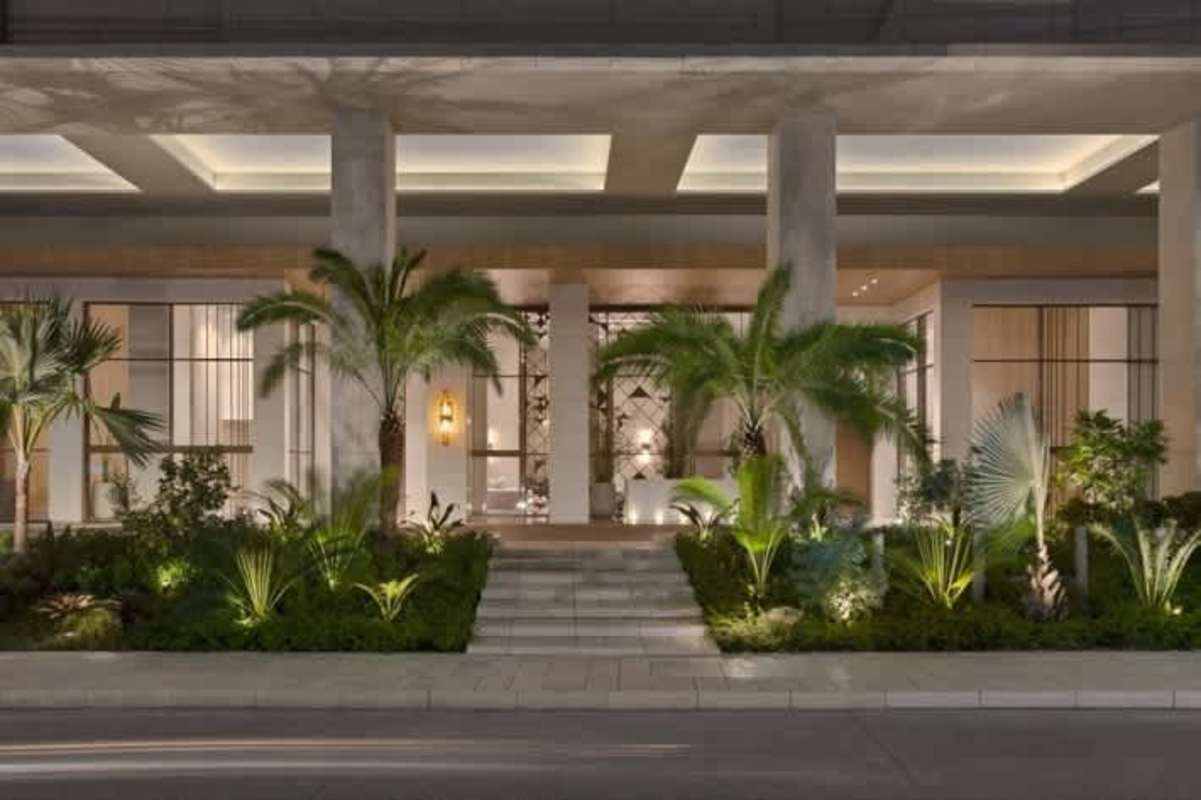 Modern entrance with large columns and tropical landscape at PH The Towers in Punta Pacifica Panama City