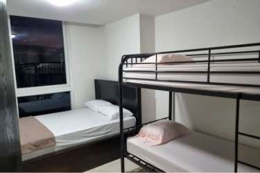 Minimalist bedroom with bunk bed large window beach condo Playa Corona San Carlos Panama