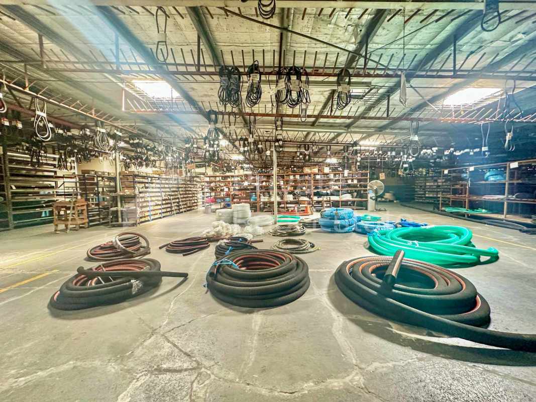 City street with commercial complex, parking, and retail visibility in Panama City