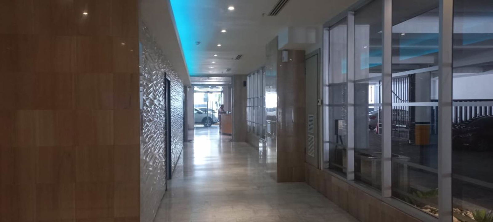 Modern building corridor with marble floors and glass partition PH GrandBay Panama