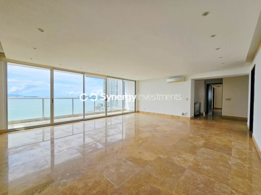 Spacious walk-in closet with built-in wood shelving PH Q Tower Punta Pacifica Panama