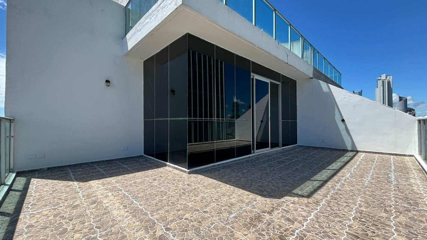 Modern terrace with glass railings city views in Ocean Sky Tower Punta Pacifica Panama
