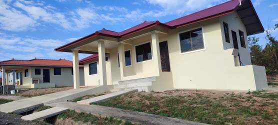 Newly built cream color house with red roof and garden Atalaya Santiago