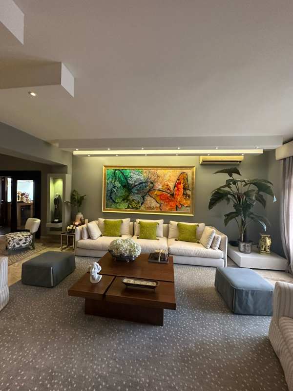 Formal dining room with large windows, marble floors and garden views in Antigua Costa del Este Panama