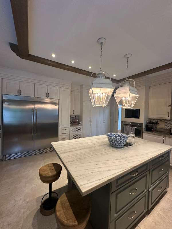 Spacious modern kitchen with marble counters, island and appliances in luxury Costa del Este villa