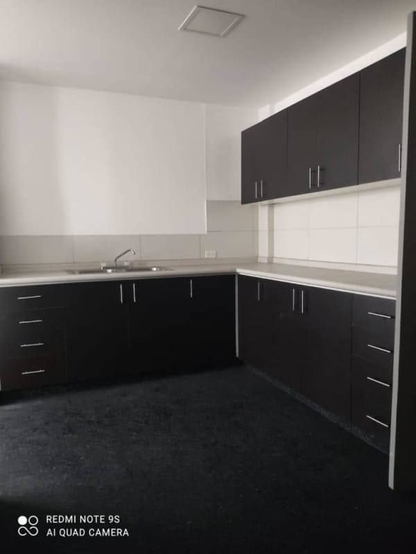 Kitchen with cabinetry and sink in remodeled rental apartment El Cangrejo Panama