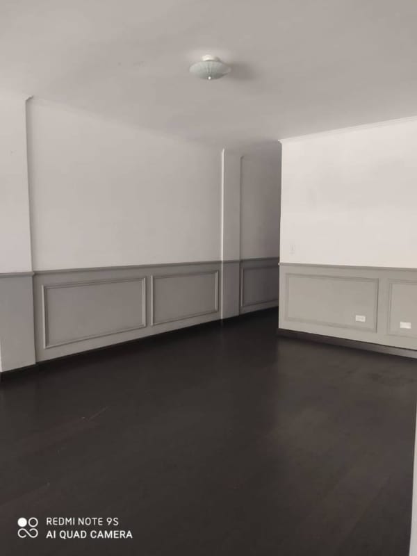 Living room with large windows in rental apartment investment building El Cangrejo Panama