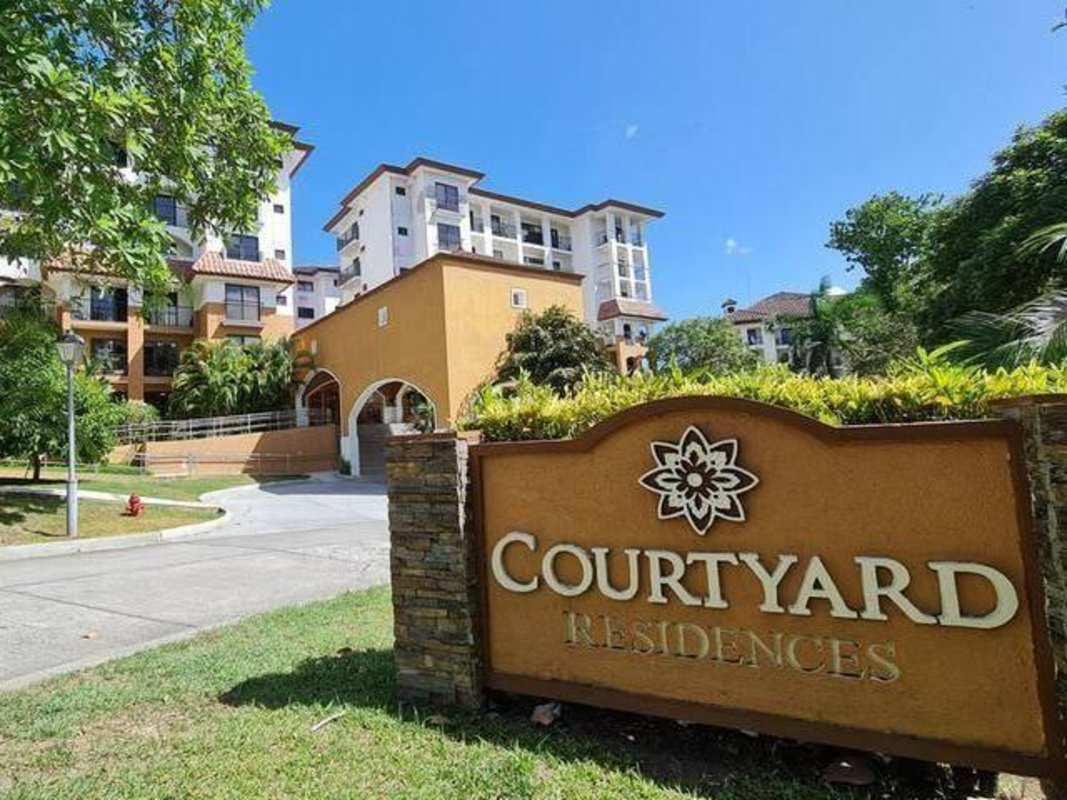 Luxury PH Embassy Club exterior Mediterranean design, lush gardens, palm trees in Clayton Panama