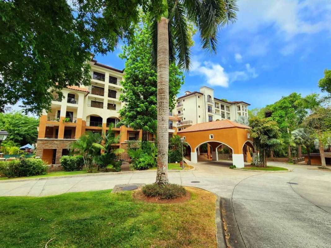 Garden courtyard lush landscaping multi-story Mediterranean buildings at Embassy Club Clayton Panama