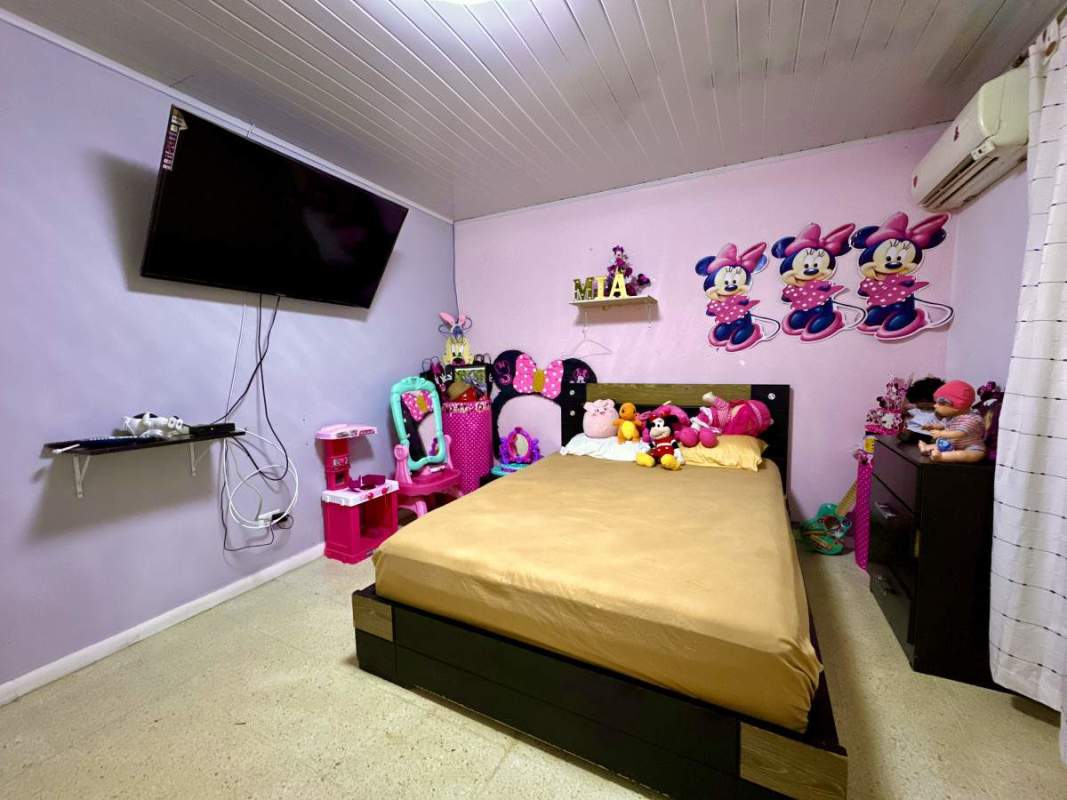 Kids bedroom with playful décor toys and mounted TV Campo Verde Las Cumbres Panama