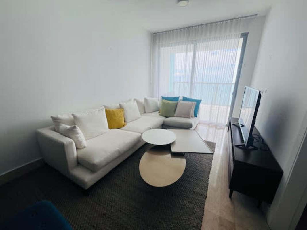 Contemporary kitchen with island, stainless steel appliances, glass backsplash in luxury PH Yoo Panama condo