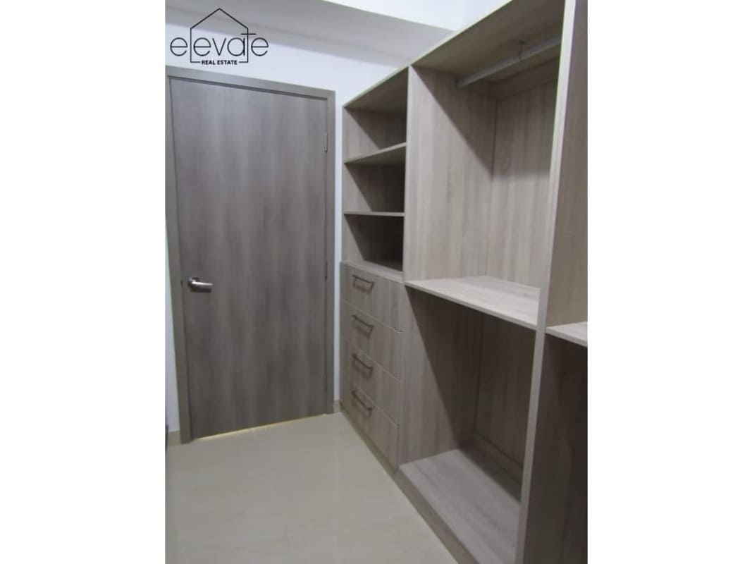 Bedroom with large built-in wardrobes and panoramic ocean views in PH Bayside Panama