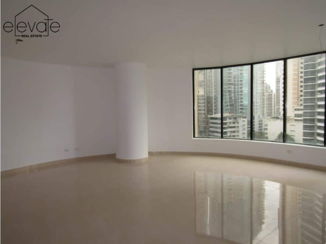 Walk-in closet with built-in shelves, light wood finish at PH Bayside Punta Paitilla