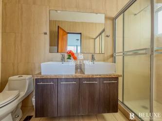 Contemporary bathroom with glass shower and modern tile PH Coral Park Playa Blanca Panama