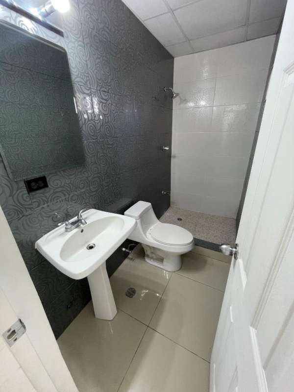 Commercial space kitchenette with stainless sink and cabinets at Plaza Kamilah San Francisco Panama