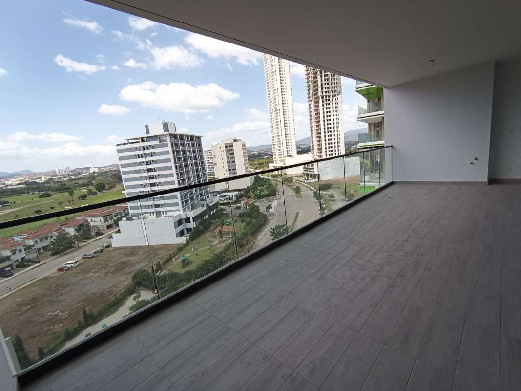 Contemporary skyscraper facade with large glass windows at PH Empire Residences in Santa María Golf community, Panama