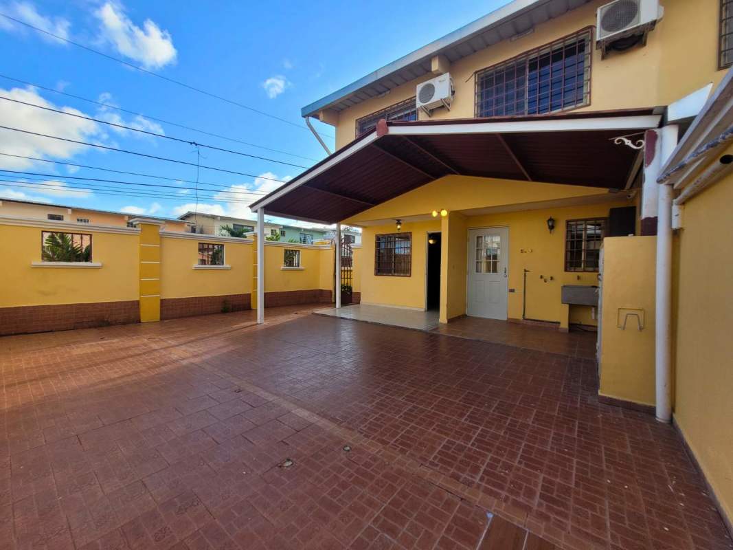 Kitchen with wood cabinets, granite countertops in duplex house Cerro Viento Panama