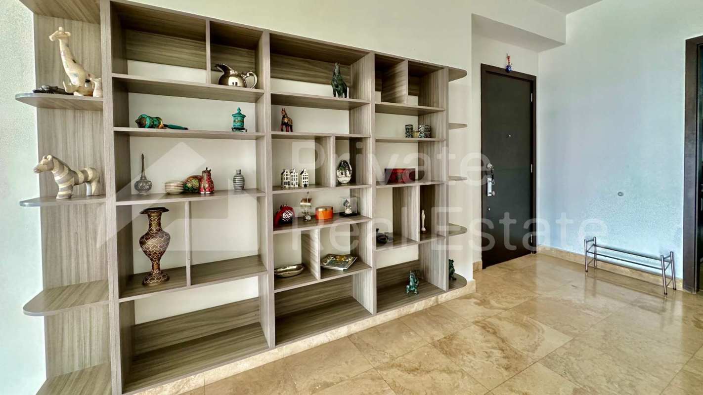 Bathroom with marble vanities and glass shower enclosure in PH Titanium Panama City