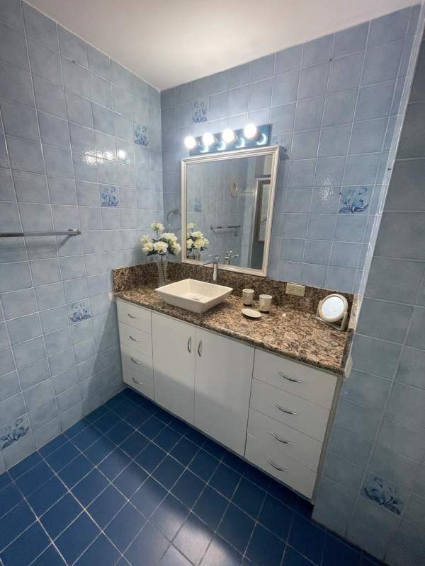 Traditional kitchen with wooden cabinets and tiled backsplash Punta Paitilla