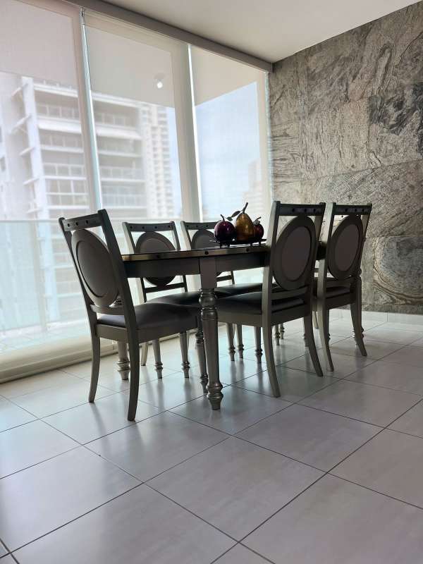 Bright dining room with large windows city view at PH Trinity Tower El Carmen Panama