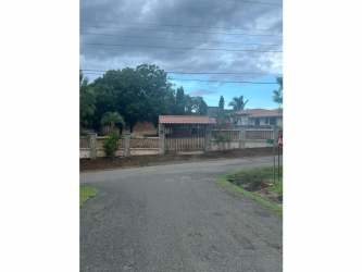 Gated residential property with trees and concrete walls in Marejobo Chitré