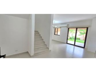 Bright living room with sliding glass doors to backyard Woodlands Panama Pacifico