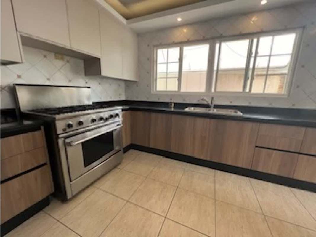 Modern kitchen stainless steel gas range, double sink, wood cabinetry PH Costa Dorada Santa Maria Panama