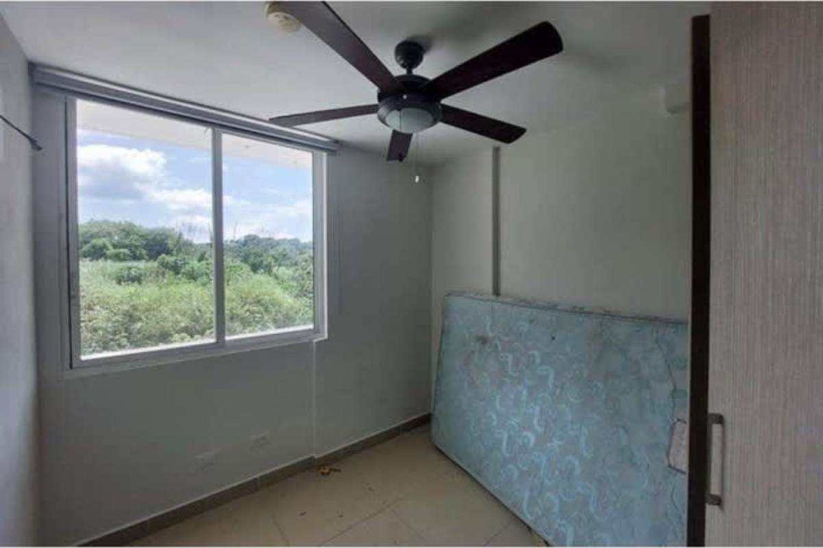 Bedroom with tiled floor, large window, ceiling fan PH Condado Gardens Apartment Condado del Rey