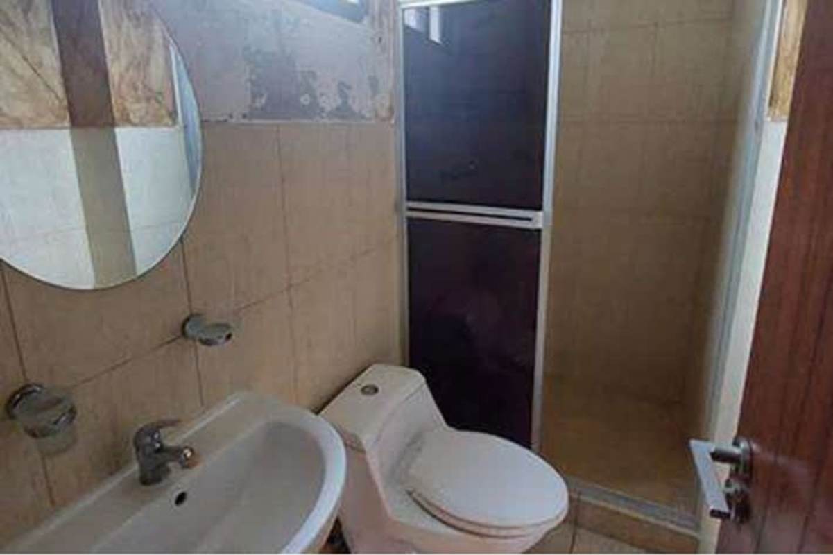 Bathroom with shower enclosure sink mirror PH Condado Country Club Panama