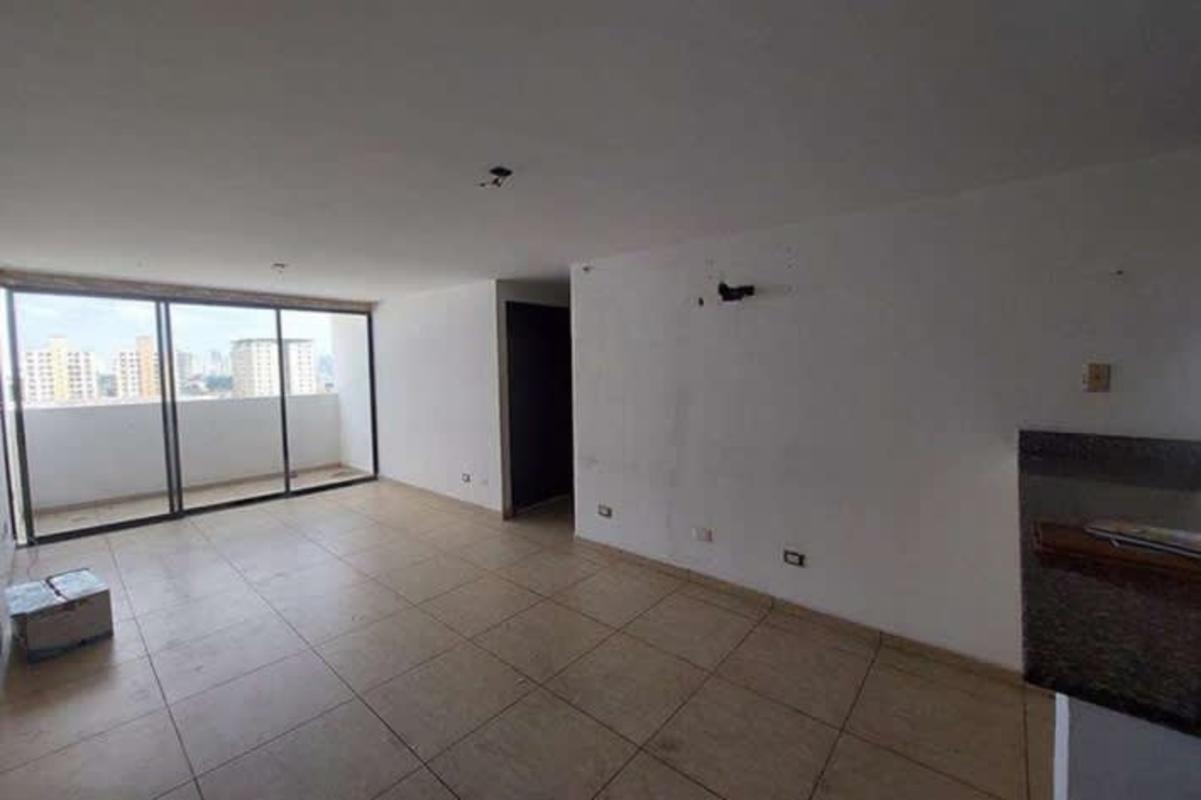 Bright living room with sliding doors to balcony city view PH Condado Country Club Panama City