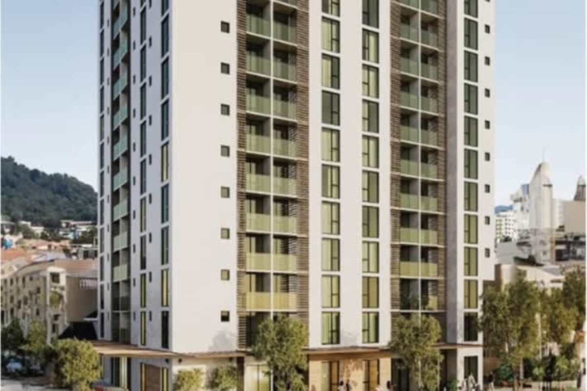 Living room in PH Bella Vista apartment with large glass windows and ocean view Panama