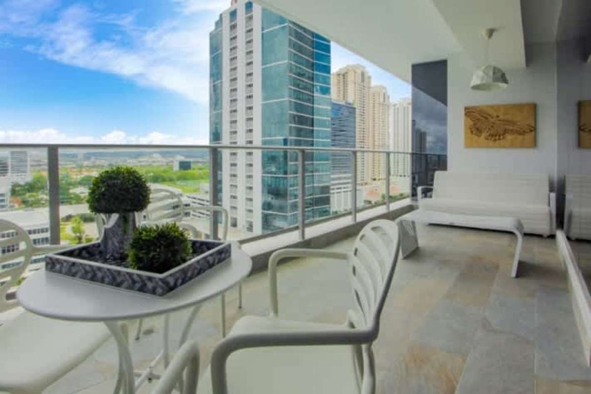Large master bedroom with marble floors, floor-to-ceiling windows and ocean views in PH Regalia