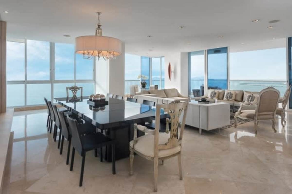 Contemporary kitchen with panoramic bay views, central island and granite counters at The Point Panama