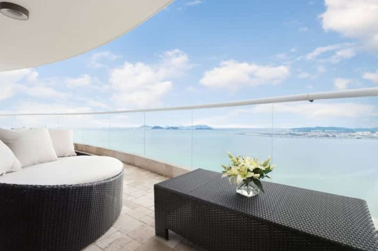 Luxurious bathroom featuring marble finishes, glass-enclosed shower and modern fixtures in The Point Panama