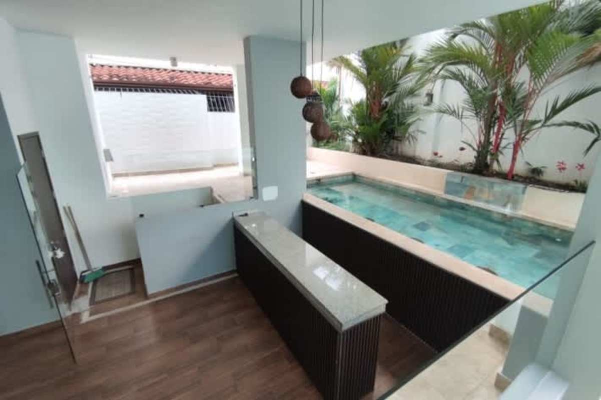 Minimalist staircase and spacious atrium in modern luxury house PH Altos del Golf Panama City