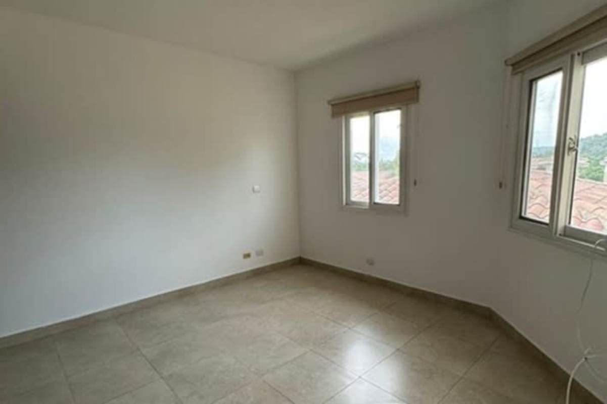 Spacious kitchen with granite countertops wood cabinetry in luxury house Ancon Panama