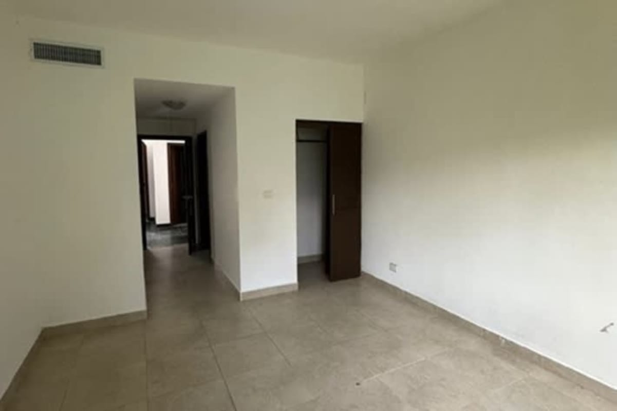 Master bedroom with ensuite bathroom garden view Ancon Panama home for sale