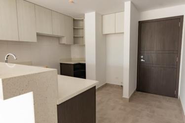 Bathroom with glass shower enclosure and mosaic tile accents in Tucan Country Club apartment